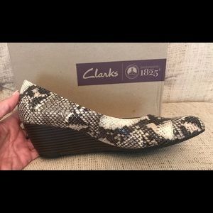 Clark’s black/white/gray snakeskin wedges. Size 11